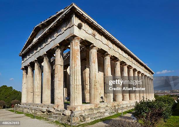 temple of hephaestus against blue skies - agora stock pictures, royalty-free photos & images