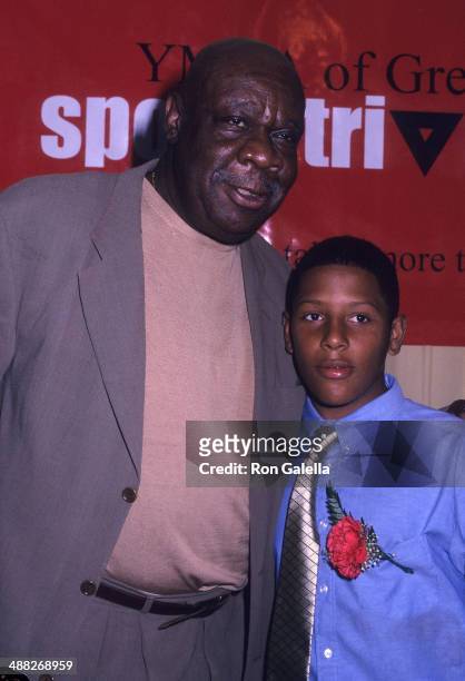 Former basketball player Cal Ramsey and YMCA kid attend the YMCA of Greater New York's First Annual Sports Triangle Dinner on July 8, 2002 at The...