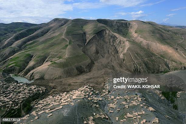 The mud and rocks of the landslide are pictured in this aerial view of Aab Bareek village at Argo district in Badakhshan province on May 5, 2014....