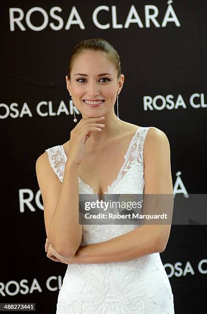 Alba Carrillo poses for the press during a fitting for designer Rosa Clara and will be presented during the 'Barcelona Bridal Fashion Week 2014' on...