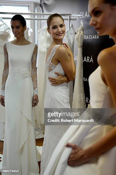 Alba Carrillo poses for the press during a fitting for designer Rosa Clara and will be presented during the 'Barcelona Bridal Fashion Week 2014' on...