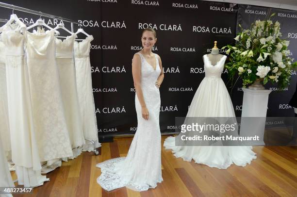 Alba Carrillo poses for the press during a fitting for designer Rosa Clara and will be presented during the 'Barcelona Bridal Fashion Week 2014' on...