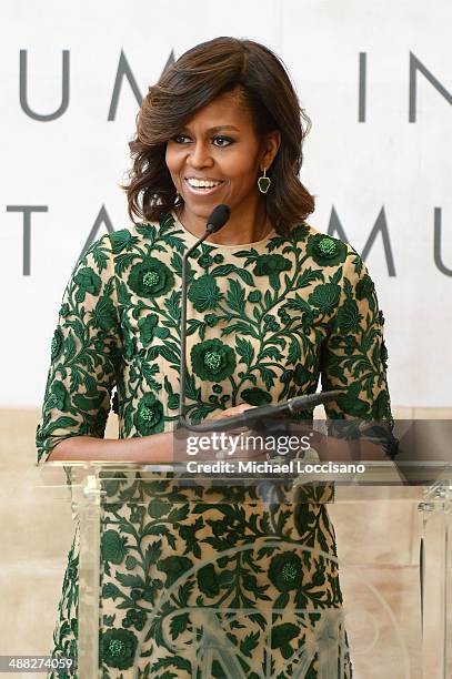 First Lady of the United States Michelle Obama speaks onstage at the Anna Wintour Costume Center Grand Opening at the Metropolitan Museum of Art on...