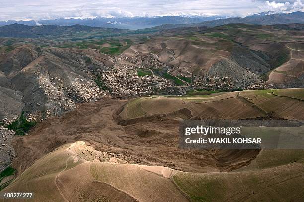 The mud and rocks of the landslide are pictured in this aerial view of Aab Bareek village at Argo district in Badakhshan province on May 5, 2014....