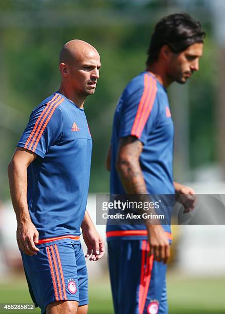 Esteban Cambiasso and Alejandro Dominguez attend a Olympiacos FC training session ahead of their UEFA Champions League Group F match against Bayern...