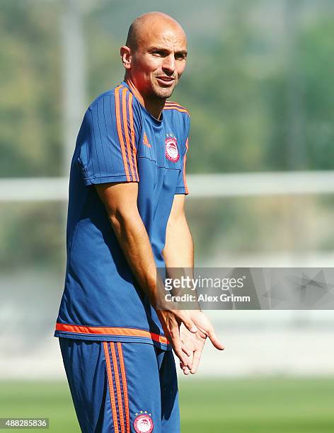 Esteban Cambiasso reacts during a Olympiacos FC training session ahead of their UEFA Champions League Group F match against Bayern Muenchen at...