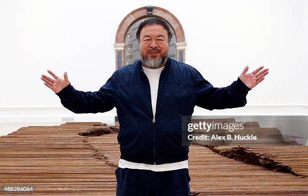 Ai Weiwei stands with his sculpture 'Straight' as he previews works from His landmark art exhibition on September 15, 2015 in London, England. The...