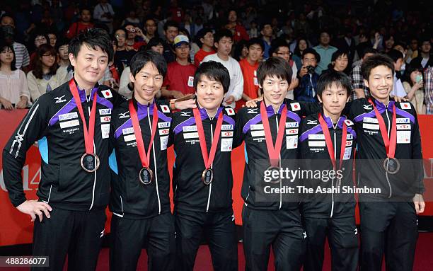 Head coach Yosuke Kurashima, Masato Shiono, Seiya Kishikawa, Kenta Matsudaira, Koki Niwa and Jun Mizutani of team Japan pose with bronze medals...