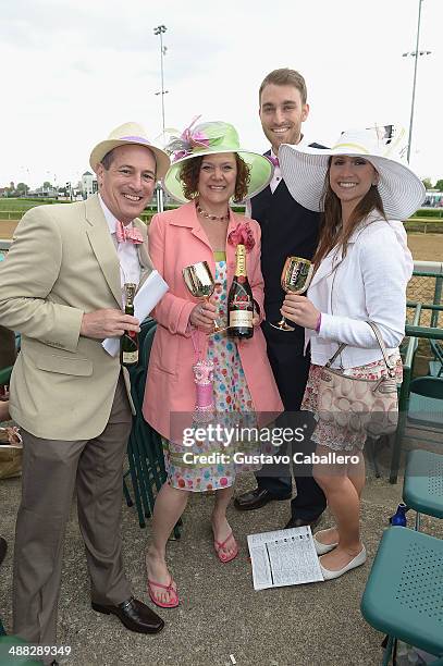 Guests attend the Moet & Chandon Toasts The 140th Kentucky Derby at Churchill Downs on May 2, 2014 in Louisville, Kentucky.