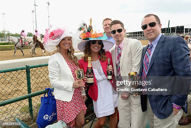 Guests attend the Moet & Chandon Toasts The 140th Kentucky Derby at Churchill Downs on May 2, 2014 in Louisville, Kentucky.