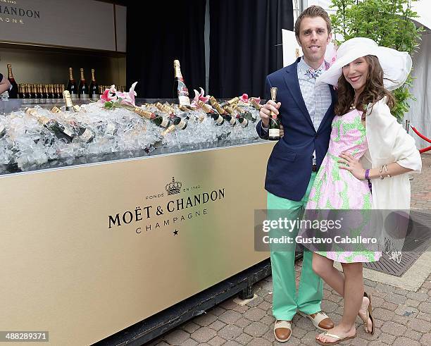 Guests attend the Moet & Chandon Toasts The 140th Kentucky Derby at Churchill Downs on May 2, 2014 in Louisville, Kentucky.