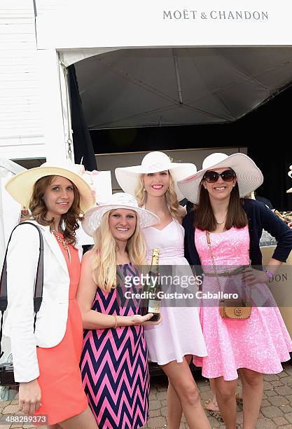 Guests attend the Moet & Chandon Toasts The 140th Kentucky Derby at Churchill Downs on May 2, 2014 in Louisville, Kentucky.