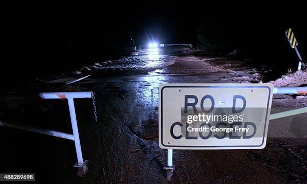 Gate closes the road as it crosses Short Creek on Hildale Street on September 15, 2015 in Hildale, Utah. Flash Floods from heavy rains on the...