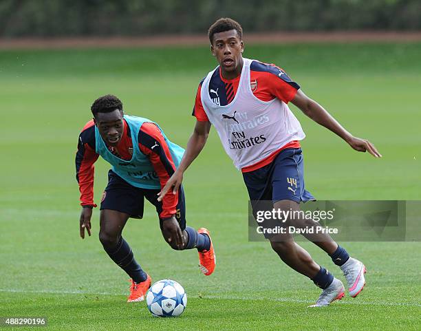 Alex Iwobi and Marc Bola of Arsenal during the U19 training session at London Colney on September 15, 2015 in St Albans, England.