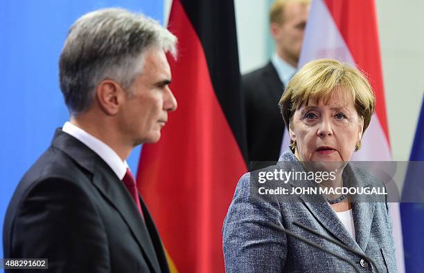 German Chancellor Angela Merkel and Austrian Chancellor Werner Faymann give a joint press conference at the Chancellery in Berlin on September 15,...