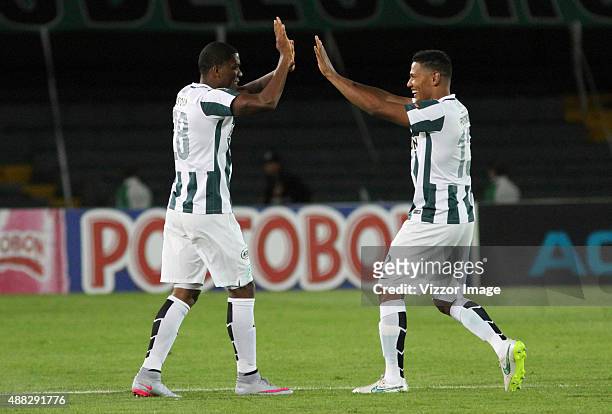 Orlando Berrio of Atletico Nacional celebrates with his teammate after scoring during a match between Deportes Tolima and Atletico Nacional as part...