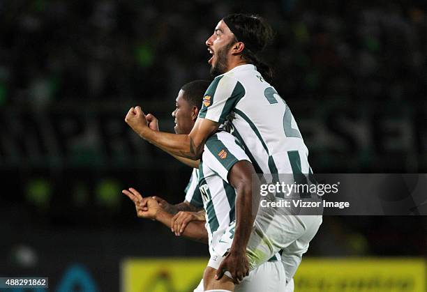 Orlando Berrio of Atletico Nacional celebrates with his teammate after scoring during a match between Deportes Tolima and Atletico Nacional as part...