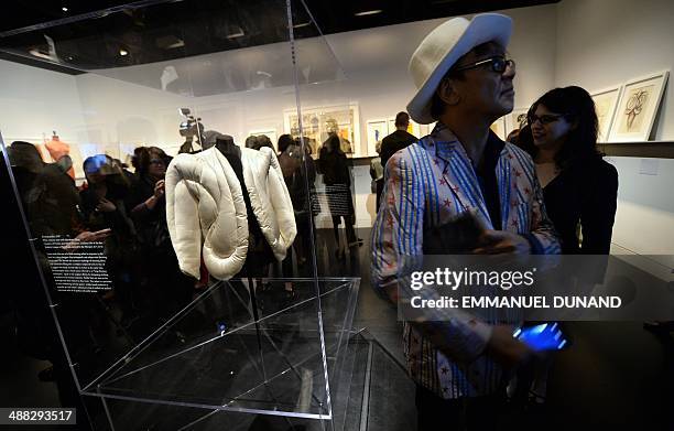 Visitors look at the "Charles James: Beyond Fashion" exhibition, during a preview the exhibit at the Costume Institute at the Metropolitan Museum of...