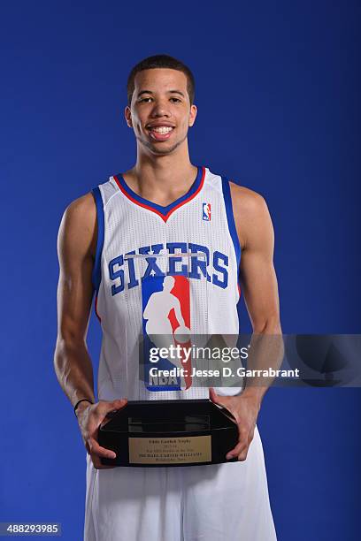 Michael Carter-Williams of the Philadelphia 76ers poses for a portrait with the Eddie Gottlieb Trophy after being named the 2013-14 Kia NBA Rookie of...
