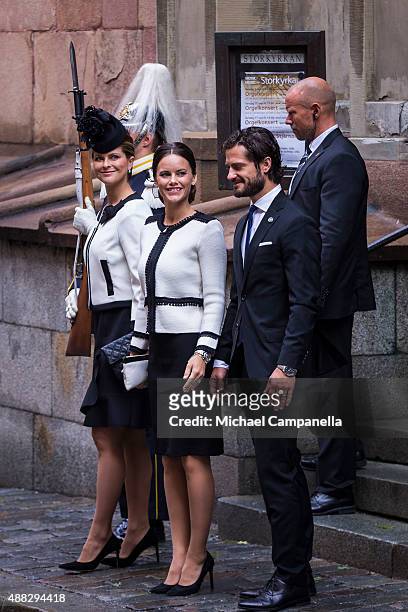 Princess Madeleine, Prince Carl Phillip, and Princess Sofia of Sweden depart after attending service at the Church of St. Nicholas in connection with...