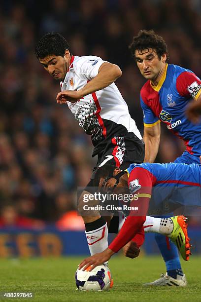 Luis Suarez of Liverpool is dispossessed as Adrian Mariappa of Crystal Palace handles the ball on the floor during the Barclays Premier League match...