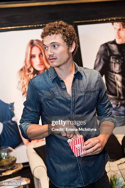 Actor Karl Glusman from 'Love' attends the Guess Portrait Studio at the Toronto International Film Festival on September 15, 2015 in Toronto, Canada.