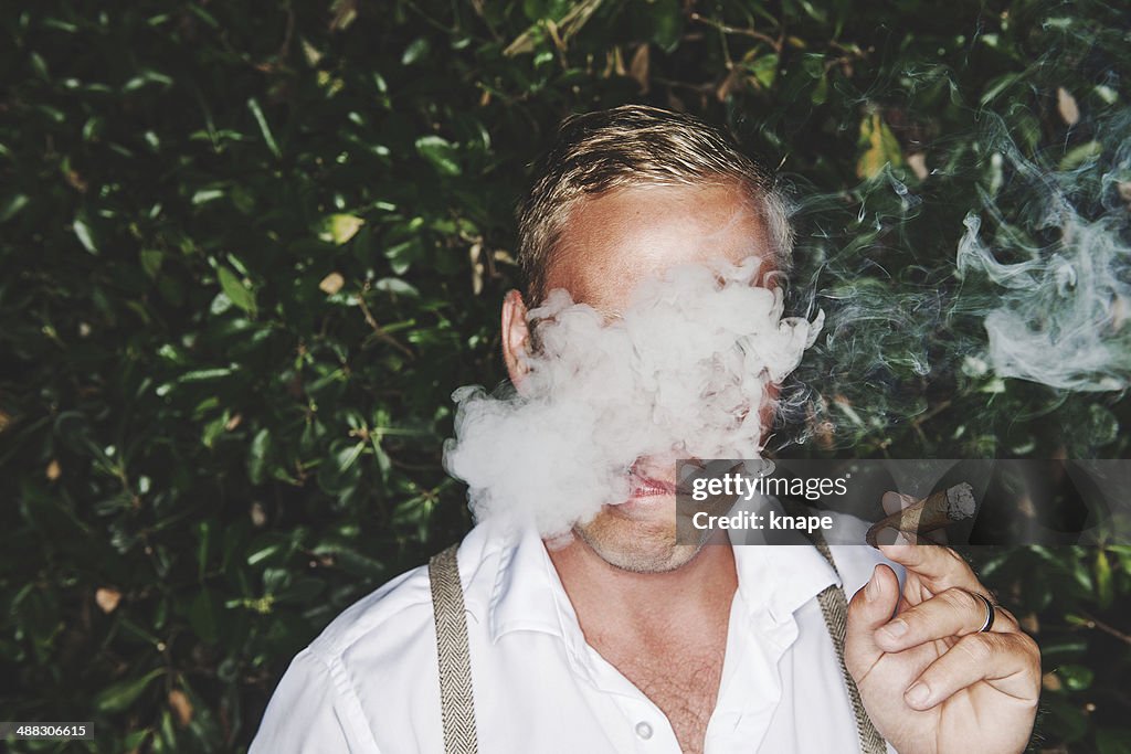 Man smoking cigar