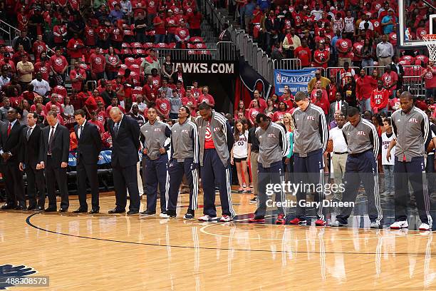 Jeff Teague and the Atlanta Hawks stand on the court before the game against the Indiana Pacers in Game Six of the Eastern Conference Quarterfinals...