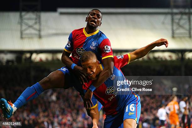 Dwight Gayle of Crystal Palace celebrates with teammate Yannick Bolasie after scoring his team's third goal to level the scores at 3-3 during the...