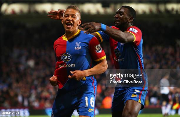Dwight Gayle of Crystal Palace celebrates with teammate Yannick Bolasie after scoring his team's third goal to level the scores at 3-3 during the...
