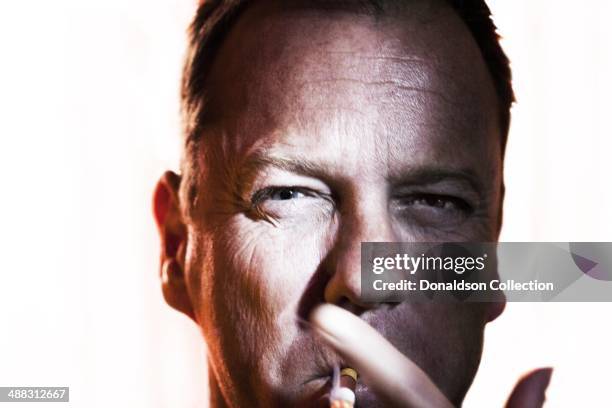 Actor Kiefer Sutherland poses for a portrait session on March 20, 2012 in Los Angeles, California.