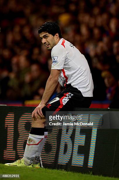 Dejected Luis Suarez of Liverpool looks on during the Barclays Premier League match between Crystal Palace and Liverpool at Selhurst Park on May 5,...