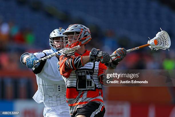Drew Snider of the Denver Outlaws in action against the Ohio Machine at Sports Authority Field at Mile High on May 4, 2014 in Denver, Colorado. The...