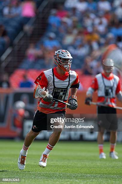 Jeremy Sieverts of the Denver Outlaws shoots and scores a two-point goal during the third quarter against the Ohio Machine at Sports Authority Field...