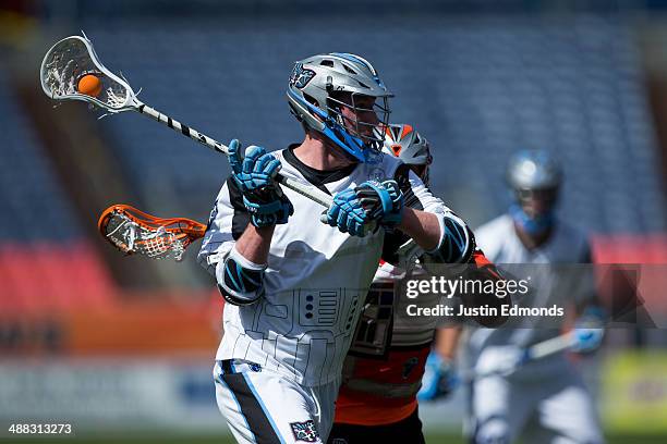 Keil Matisz of the Ohio Machine in action against the Denver Outlaws at Sports Authority Field at Mile High on May 4, 2014 in Denver, Colorado. The...