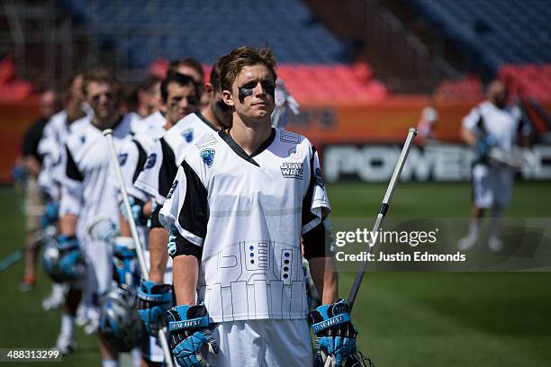 The Ohio Machine stands during the National Anthem before a game against the Denver Outlaws at Sports Authority Field at Mile High on May 4, 2014 in...