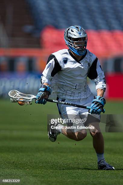 Chase Carraro of the Ohio Machine in action against the Denver Outlaws at Sports Authority Field at Mile High on May 4, 2014 in Denver, Colorado. The...