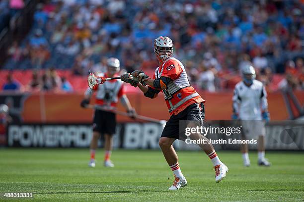 Jeremy Sieverts of the Denver Outlaws shoots and scores a two-point goal during the third quarter against the Ohio Machine at Sports Authority Field...