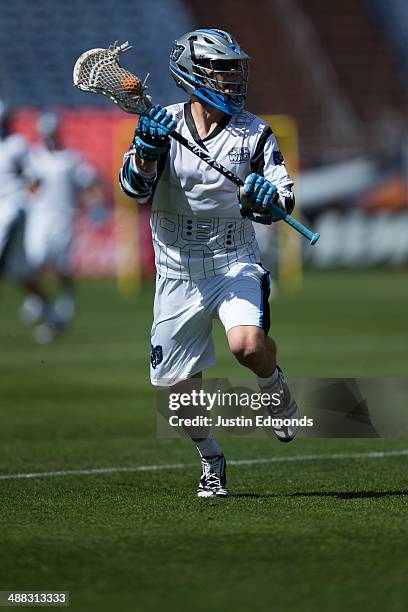 Chase Carraro of the Ohio Machine in action against the Denver Outlaws at Sports Authority Field at Mile High on May 4, 2014 in Denver, Colorado. The...