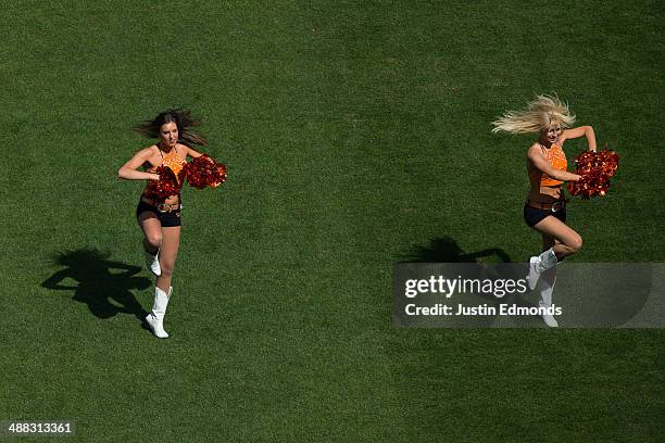 The Denver Outlaws cheerleaders perform during a break in the action against the Ohio Machine at Sports Authority Field at Mile High on May 4, 2014...