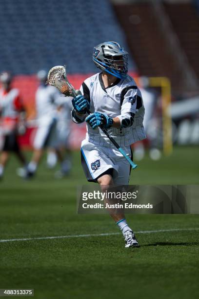 Chase Carraro of the Ohio Machine in action against the Denver Outlaws at Sports Authority Field at Mile High on May 4, 2014 in Denver, Colorado. The...