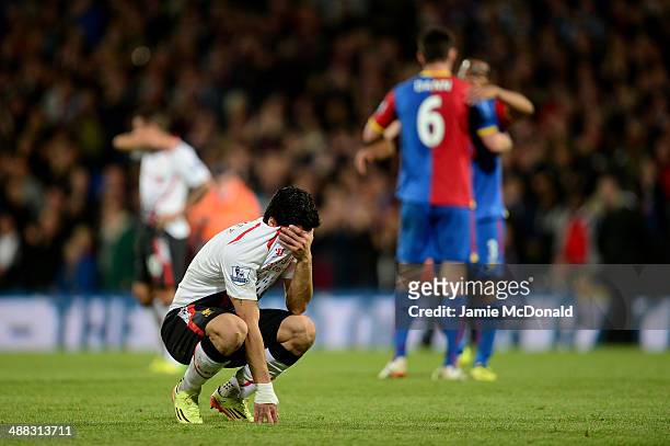 Dejected Luis Suarez of Liverpool reacts following his team's 3-3 draw during the Barclays Premier League match between Crystal Palace and Liverpool...