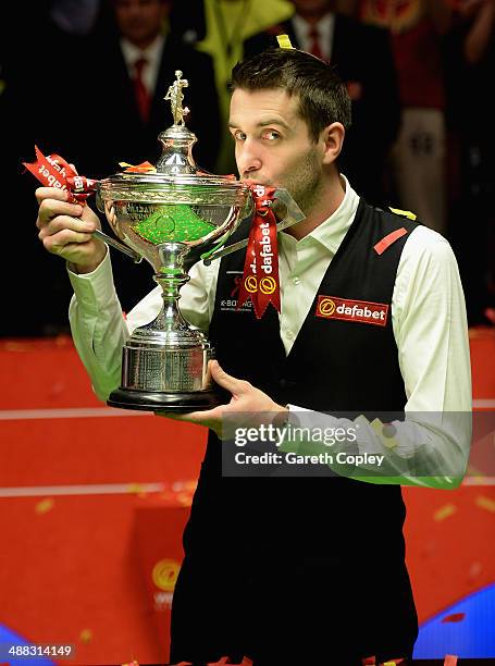 Mark Selby lifts the trophy after winning The Dafabet World Snooker Championship final at Crucible Theatre on May 5, 2014 in Sheffield, England.