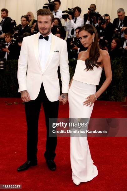 David Beckham and Victoria Beckham attend the "Charles James: Beyond Fashion" Costume Institute Gala at the Metropolitan Museum of Art on May 5, 2014...