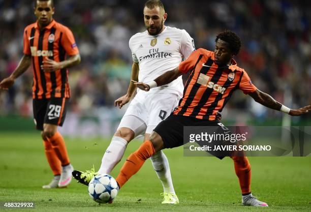 Real Madrid's French forward Karim Benzema vies with Shakhtar Donetsk's Brazilian midfielder Fred during the UEFA Champions League group A football...