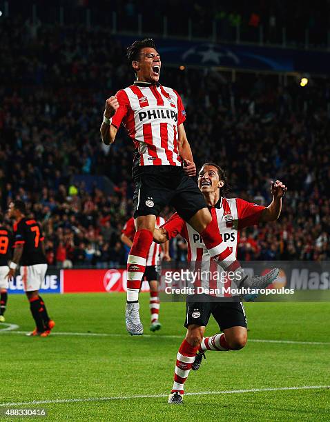 Hector Moreno of PSV Eindhoven celebrates as he scores their first and equalising goal during the UEFA Champions League Group B match between PSV...