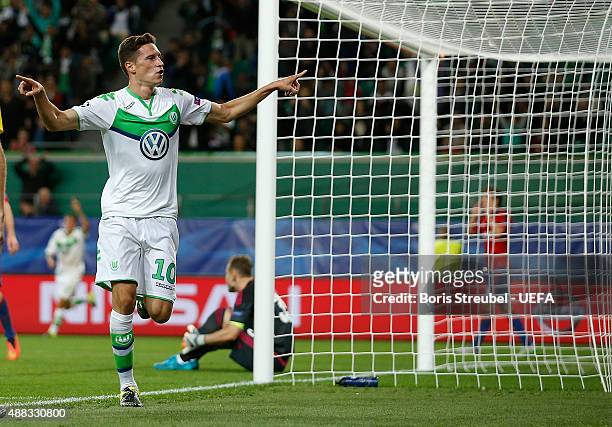 Julian Draxler of Wolfsburg celebrates after scoring his team's first goal during the UEFA Champions League group B match between VfL Wolfsburg and...