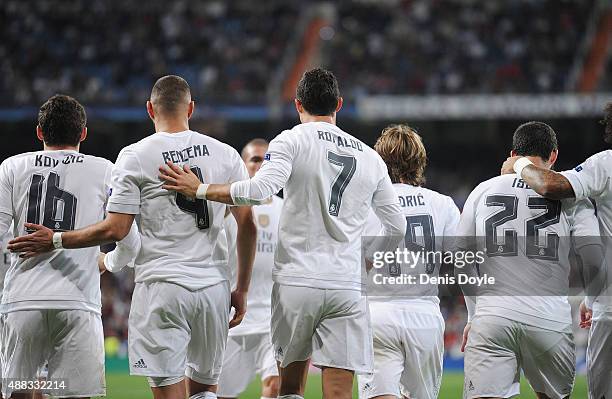 Cristiano Ronaldo of Real Madrid celebrates with Karim Benzema after scoring Real's 2nd goal from the penalty spot during the UEFA Champions League...