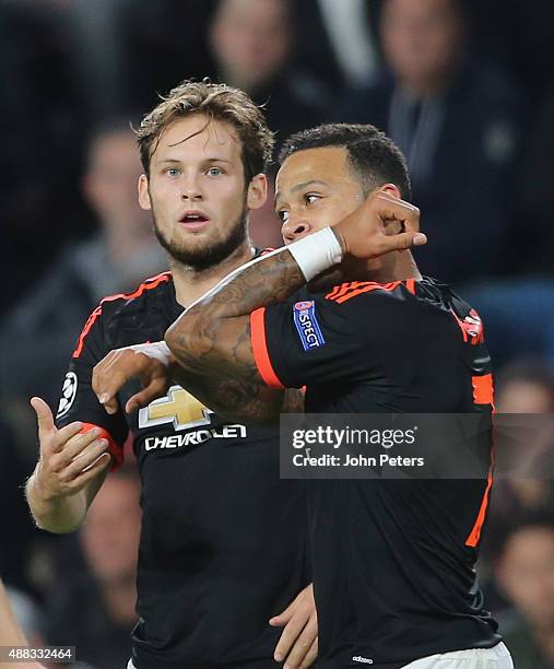 Memphis Depay of Manchester United celebrates scoring their first goal during the UEFA Champions League match between PSV Eindhoven and Manchester...