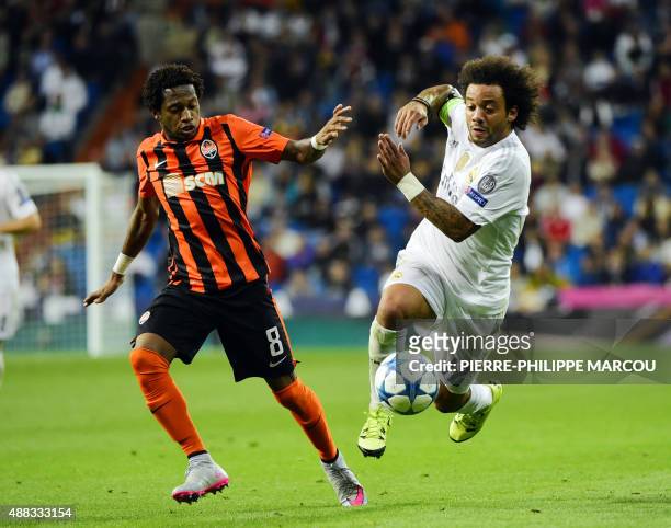 Real Madrid's Brazilian defender Marcelo vies with Shakhtar Donetsk's Brazilian midfielder Fred during the UEFA Champions League group A football...
